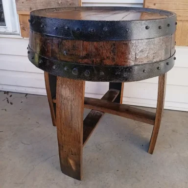 barrel end table with dark stain and black metal rings